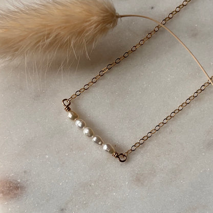 Necklace with pearls on a marble surface