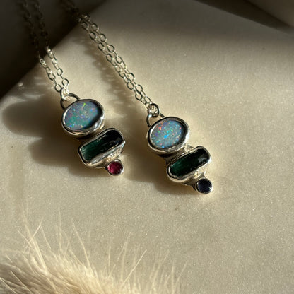 Necklace with gemstone pendants on a soft surface