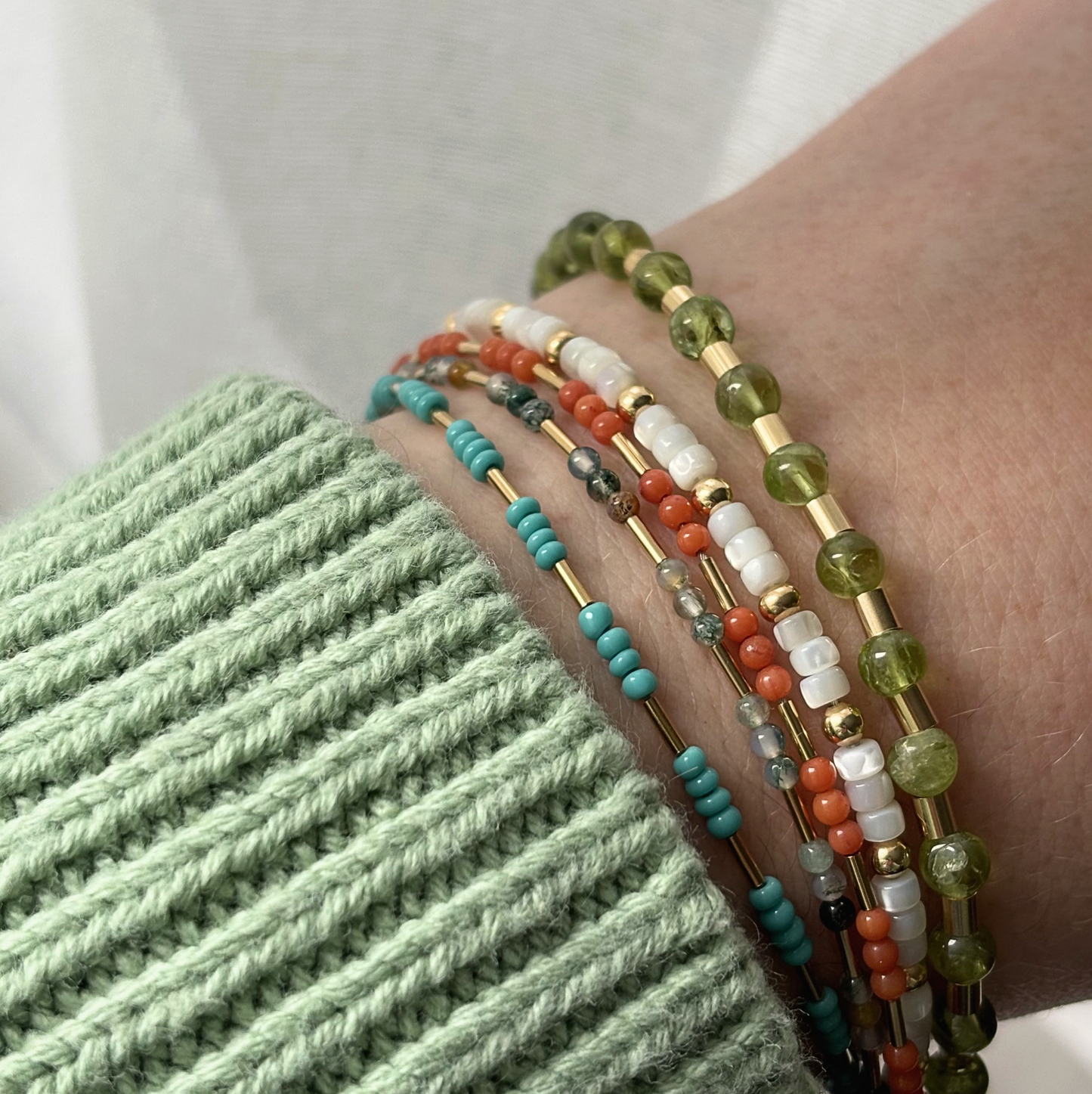 beaded bracelets on an arm