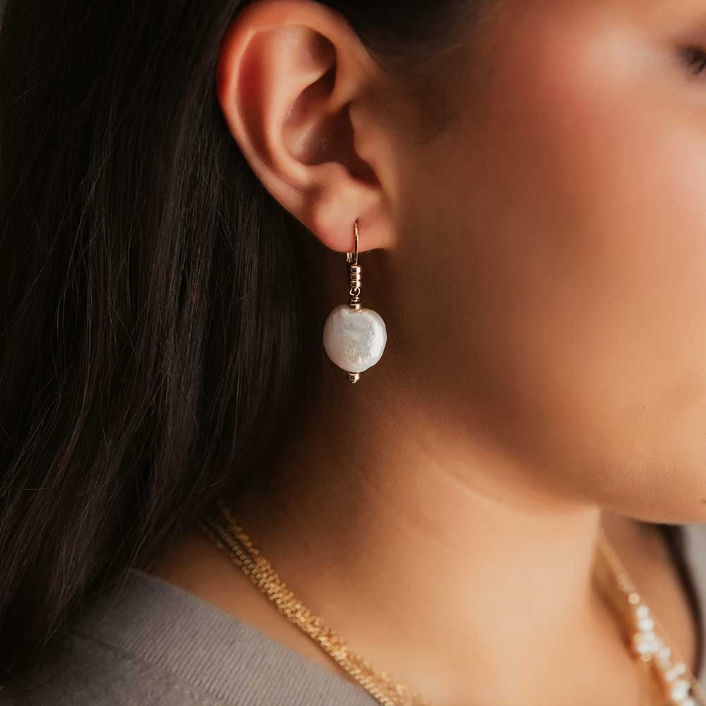 strut jewelry pearl medallion dangle earrings